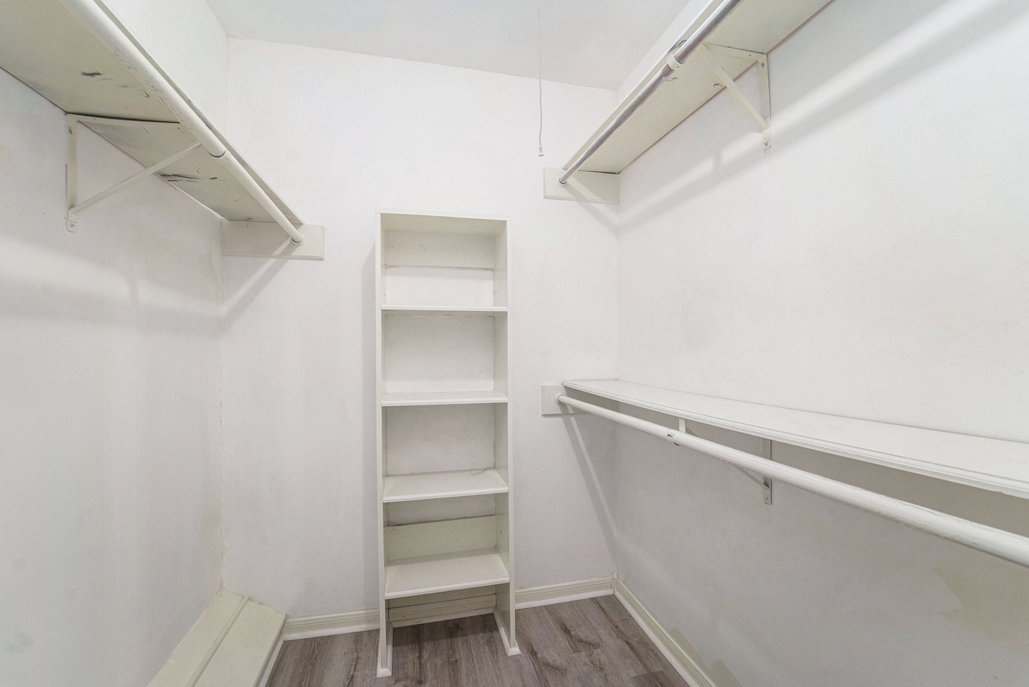 23235 Earlmist Drive Spring, TX 77373 - Photo 17 of 33 a view of walk in closet with empty racks