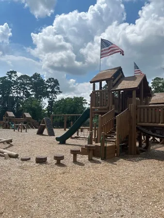 a view of a house with a snow on the road