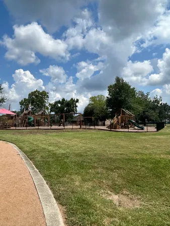 a view of a garden and basketball court