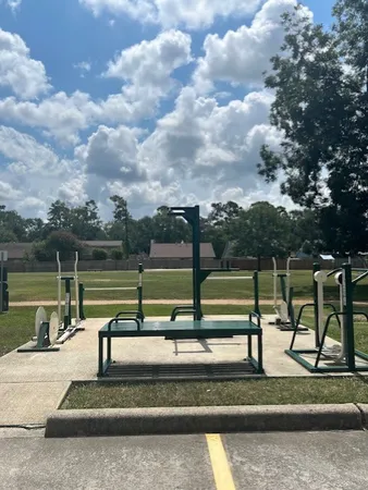 a view of a park with swings and slides
