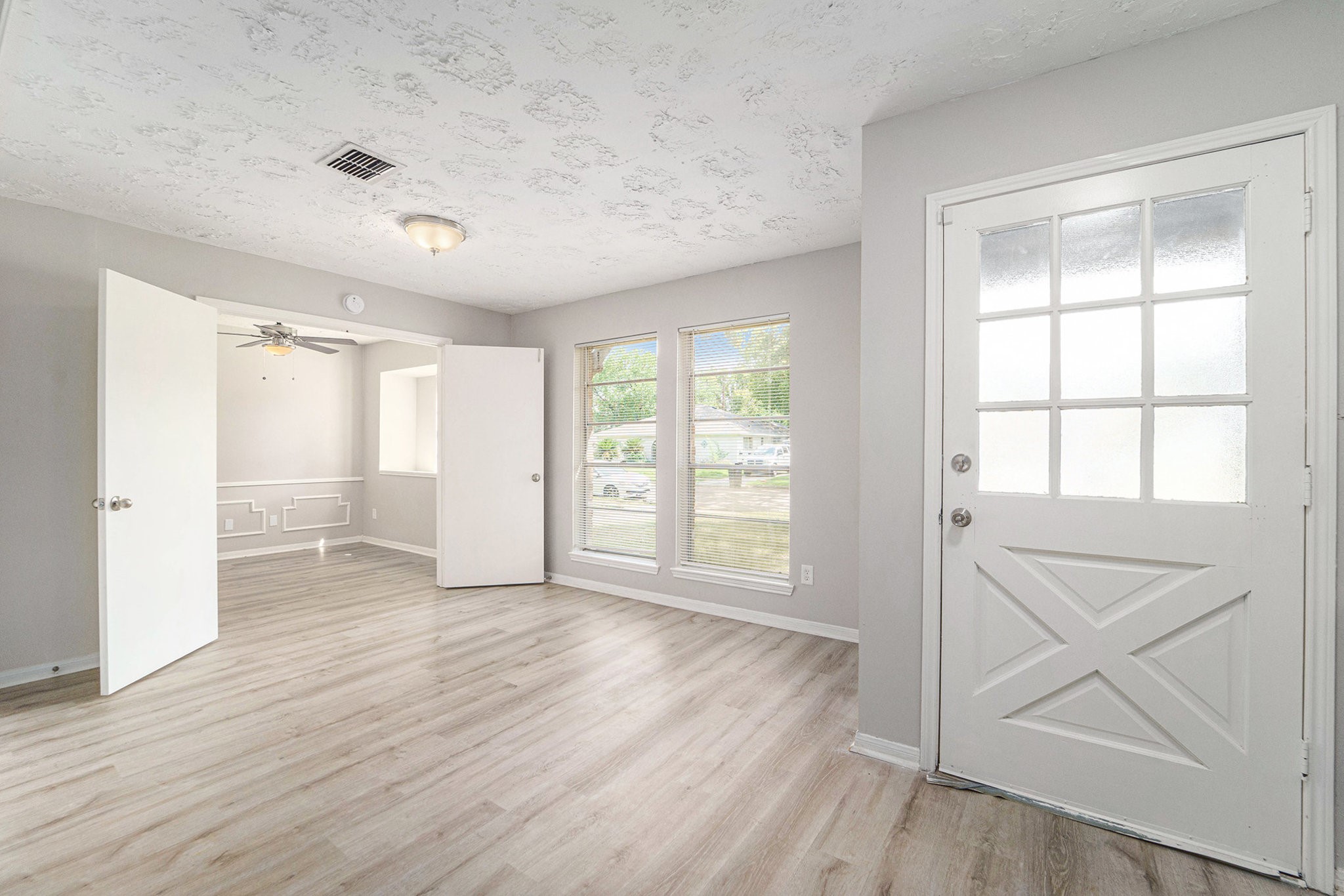 23235 Earlmist Drive Spring, TX 77373 - Photo 8 of 33 a view of an empty room with wooden floor and a window