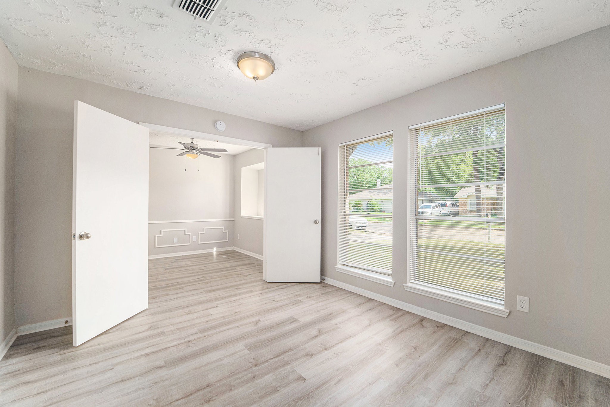 23235 Earlmist Drive Spring, TX 77373 - Photo 9 of 33 a view of an empty room with wooden floor and a window