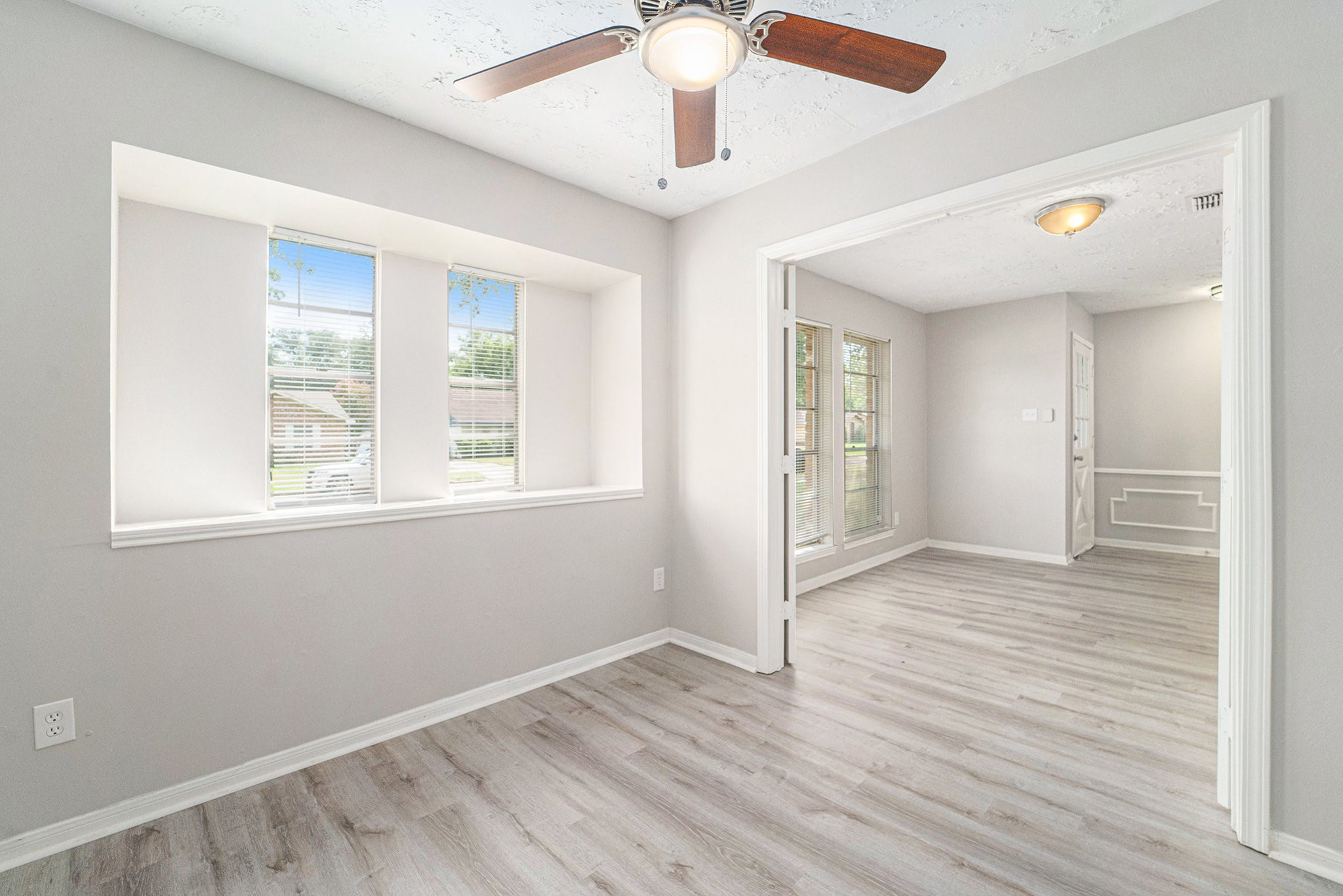 23235 Earlmist Drive Spring, TX 77373 - Photo 10 of 33 a view of an empty room with wooden floor and a window