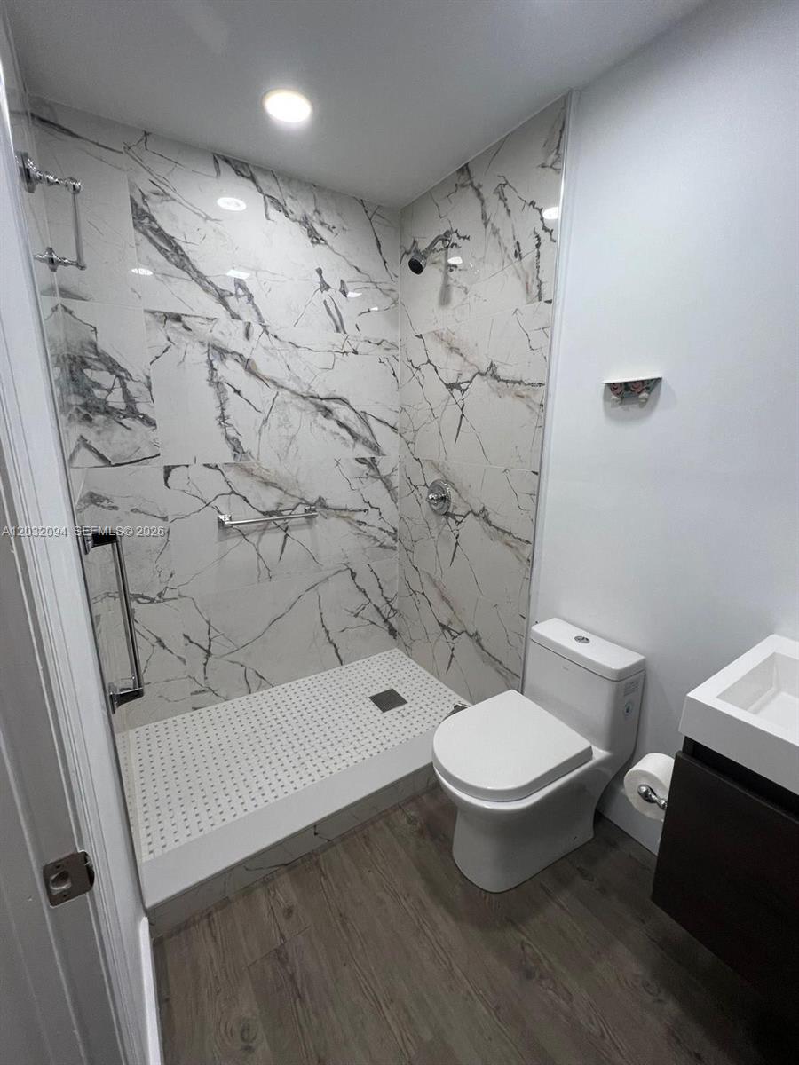 6492 Southwest 25th Street Miramar, FL 33023 - Photo 4 of 9 a bathroom with a toilet and a shower