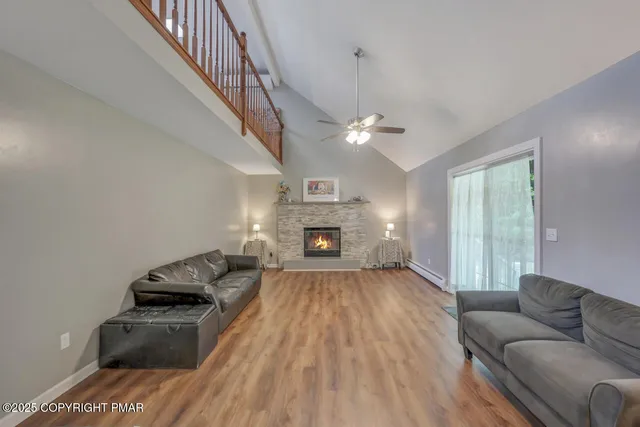 a kitchen with stainless steel appliances granite countertop a stove and a wooden floors