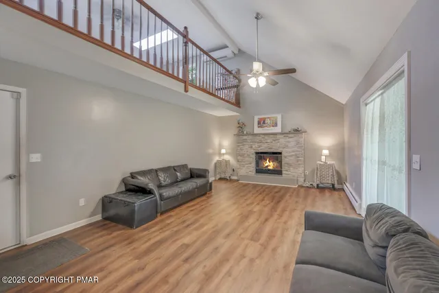 a kitchen with stainless steel appliances granite countertop a sink stove and wooden floor
