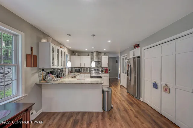 a view of a livingroom with furniture and a couch