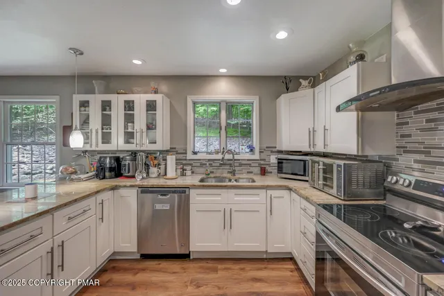 a bathroom with a sink toilet and mirror