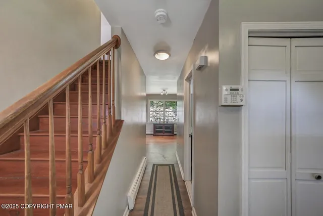 a bedroom with bed and a book shelf