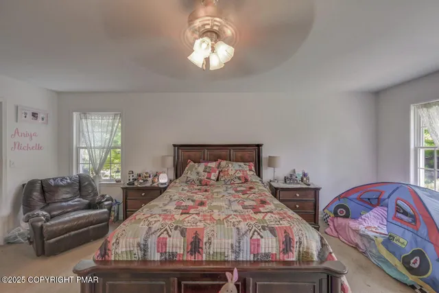 a media room with lots of chairs and a projector screen