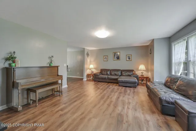 a bathroom with a toilet a sink and a window