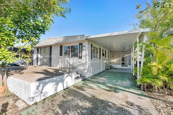 a view of a house with backyard