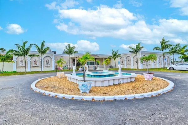a view of a swimming pool with a yard