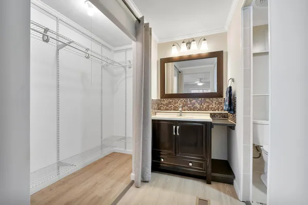 a bathroom with a sink and a mirror