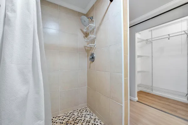 a bathroom with a glass shower door
