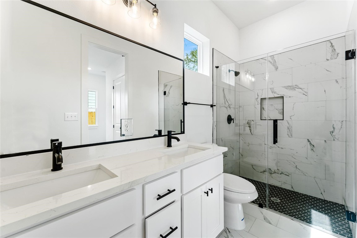 8506 Wileyvale Road, Unit A Houston, TX 77016 - Photo 19 of 24 Oversized shower with marble tile surround