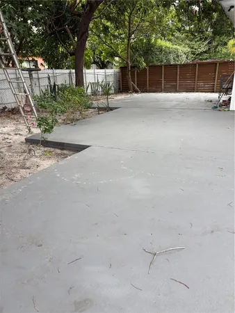 a view of a backyard of the house
