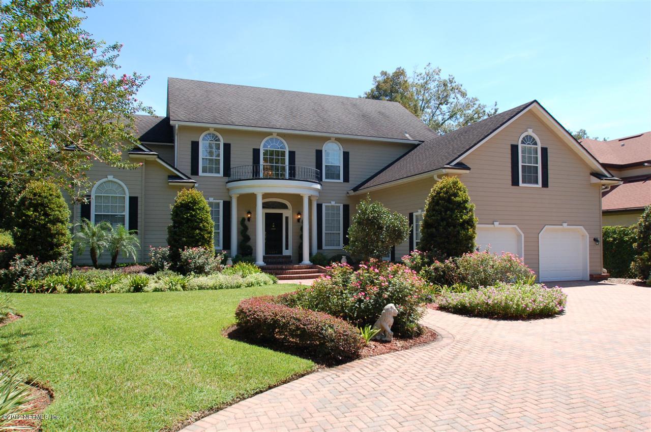 4665 Raggedy Point Road Fleming Island, FL 32003 - Photo 1 of 85 a front view of a house with a yard