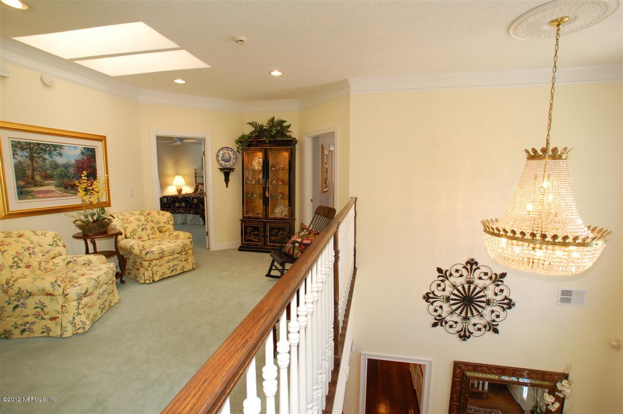 4665 Raggedy Point Road Fleming Island, FL 32003 - Photo 13 of 85 a view of a living room and dining room