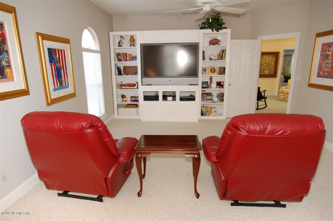 4665 Raggedy Point Road Fleming Island, FL 32003 - Photo 14 of 85 a living room with furniture and a flat screen tv