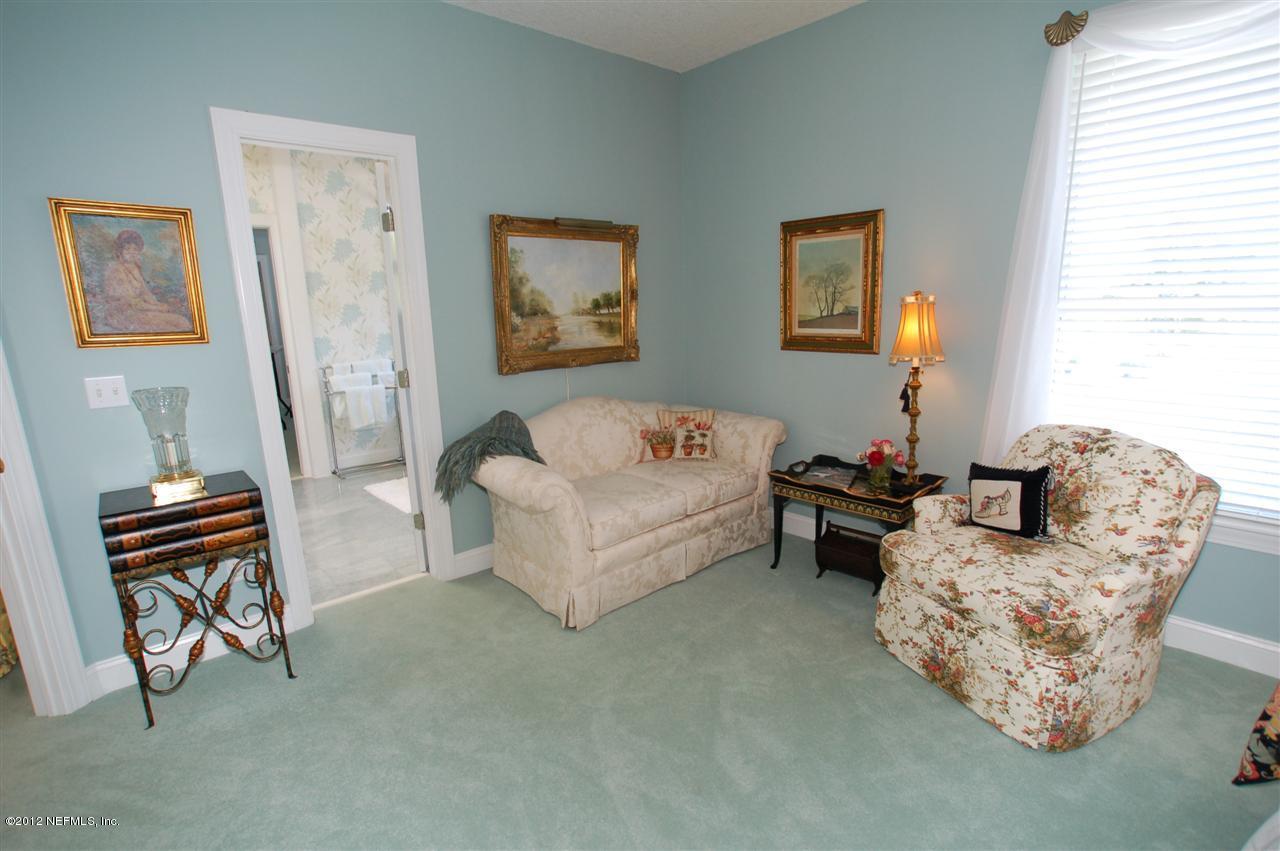 4665 Raggedy Point Road Fleming Island, FL 32003 - Photo 17 of 85 a living room with furniture and a window