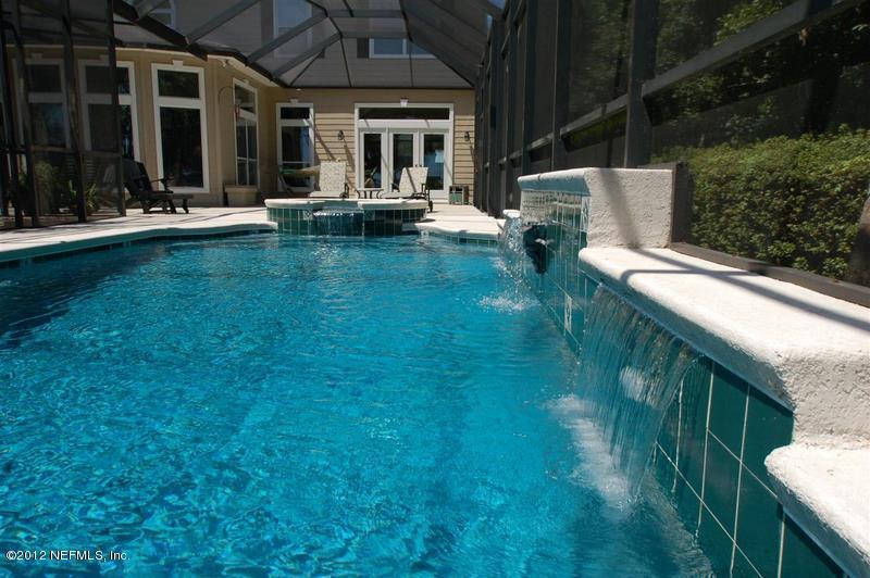 4665 Raggedy Point Road Fleming Island, FL 32003 - Photo 23 of 85 a view of a house with backyard porch and sitting area