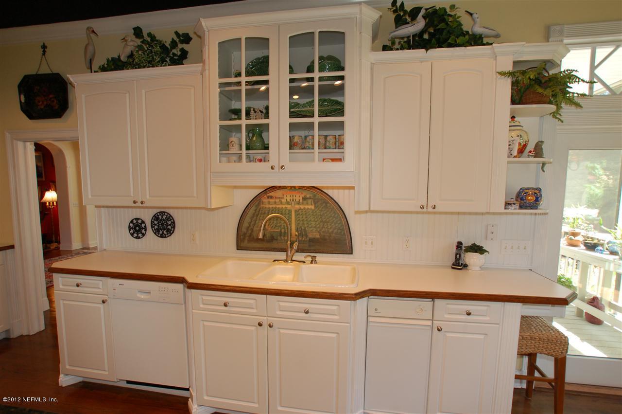 4665 Raggedy Point Road Fleming Island, FL 32003 - Photo 33 of 85 a view of a kitchen with a sink and cabinets
