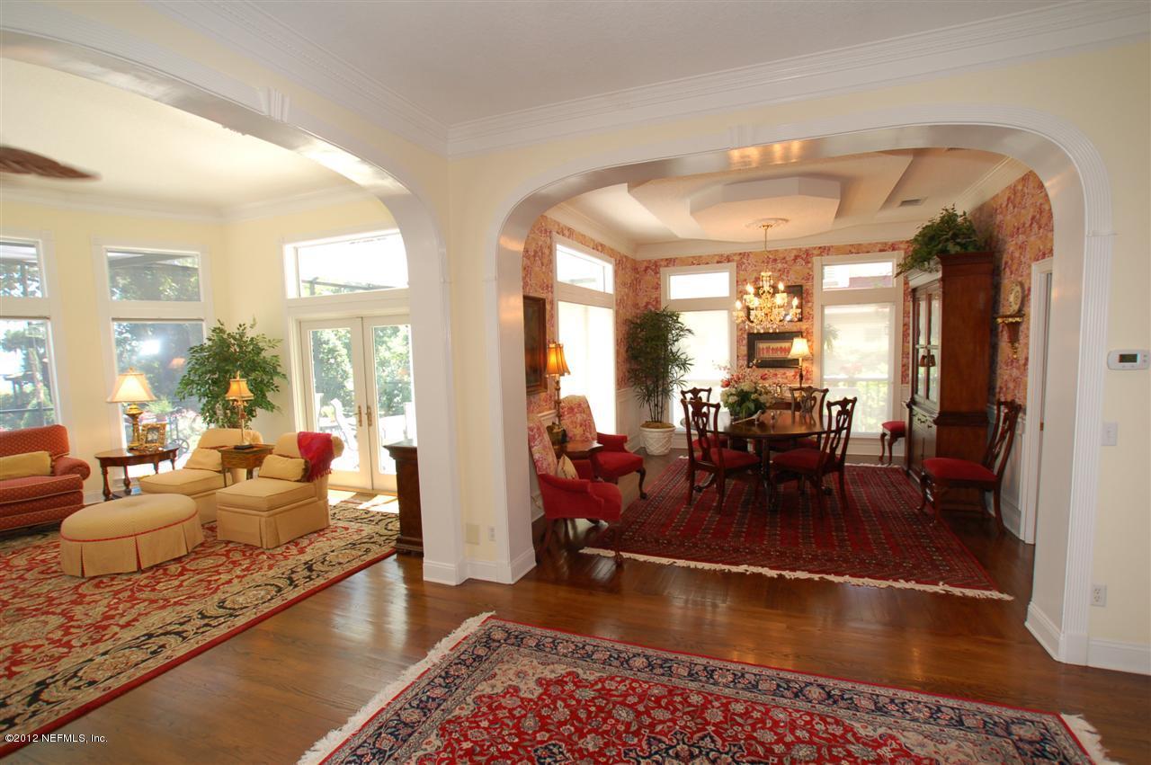4665 Raggedy Point Road Fleming Island, FL 32003 - Photo 40 of 85 a living room with furniture and a large window