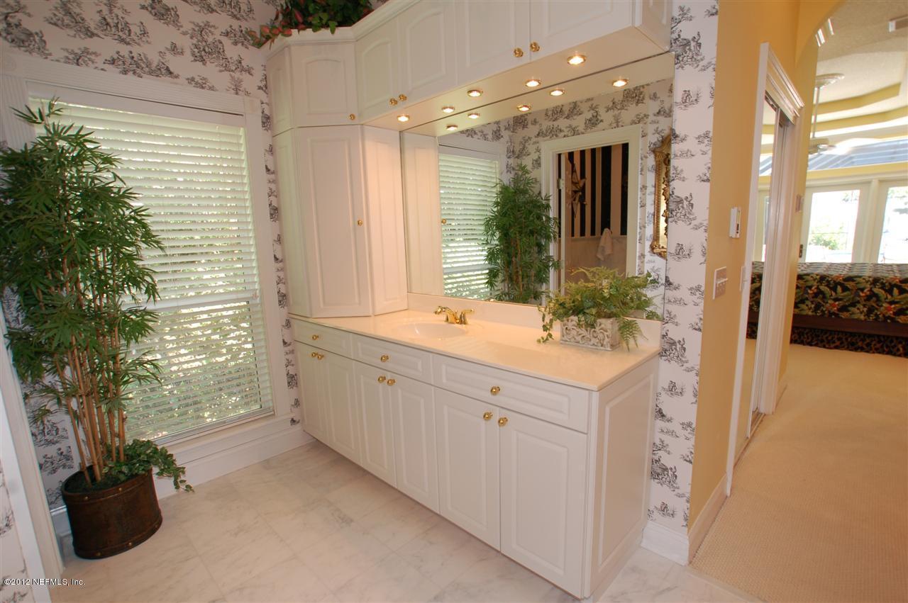 4665 Raggedy Point Road Fleming Island, FL 32003 - Photo 42 of 85 a bathroom with a double vanity sink and a mirror