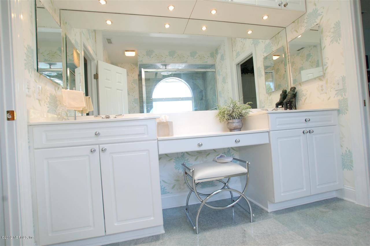 4665 Raggedy Point Road Fleming Island, FL 32003 - Photo 43 of 85 a bathroom with a sink vanity and a mirror