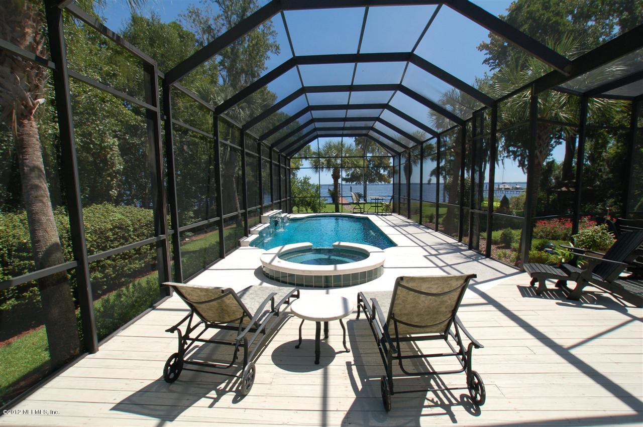 4665 Raggedy Point Road Fleming Island, FL 32003 - Photo 52 of 85 a view of a table and chairs in patio