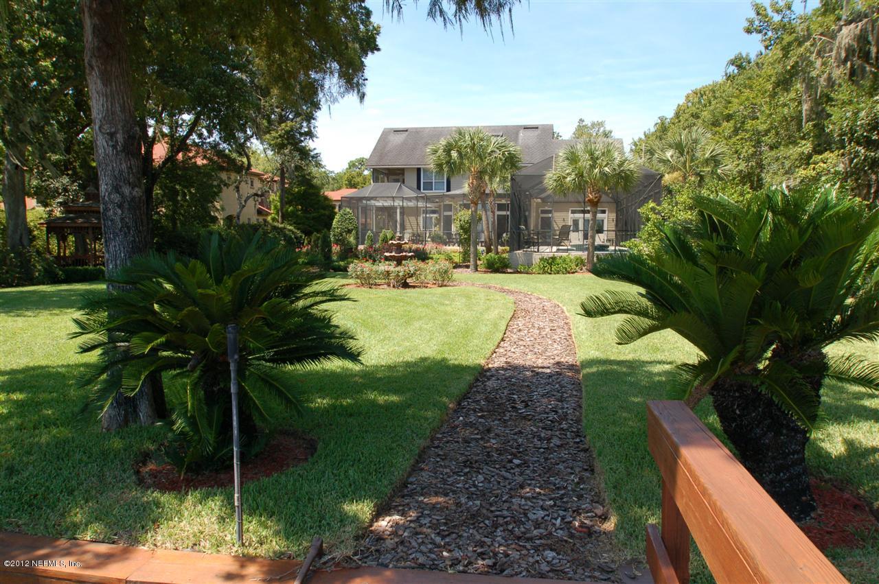 4665 Raggedy Point Road Fleming Island, FL 32003 - Photo 58 of 85 a view of a swimming pool with a patio
