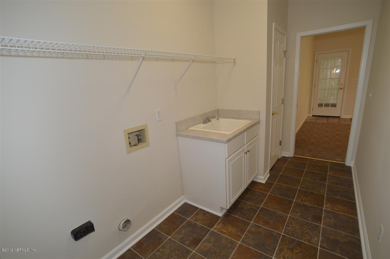 4665 Raggedy Point Road Fleming Island, FL 32003 - Photo 69 of 85 a bathroom with a sink toilet and shower