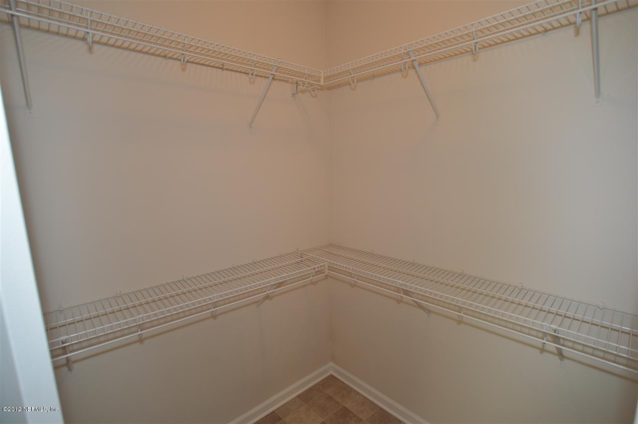 4665 Raggedy Point Road Fleming Island, FL 32003 - Photo 71 of 85 a view of a room with racks on the wall