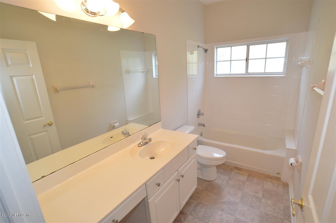 4665 Raggedy Point Road Fleming Island, FL 32003 - Photo 75 of 85 a bathroom with a sink a toilet and shower