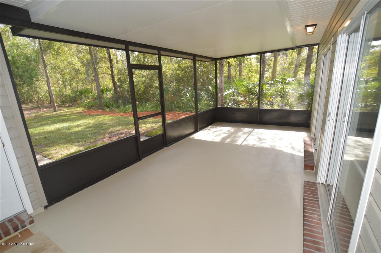 4665 Raggedy Point Road Fleming Island, FL 32003 - Photo 77 of 85 a view of a large window with an outdoor space
