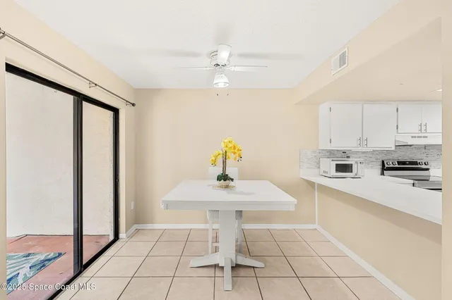 a kitchen with a sink cabinets and window