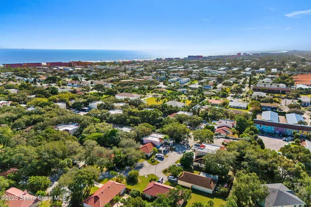 an aerial view of a city with lots of residential buildings