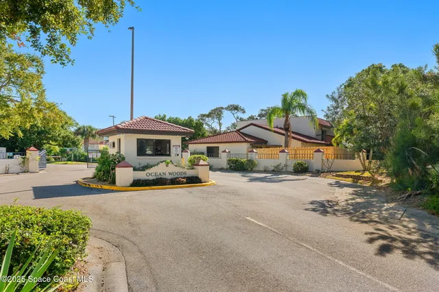a view of a house with outdoor space and a car parked