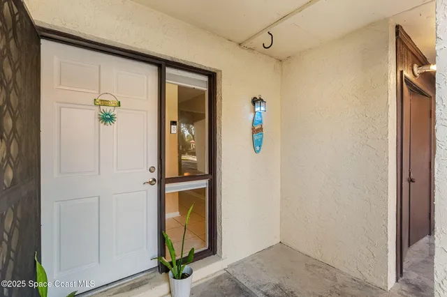 a view of an entryway with wooden floor