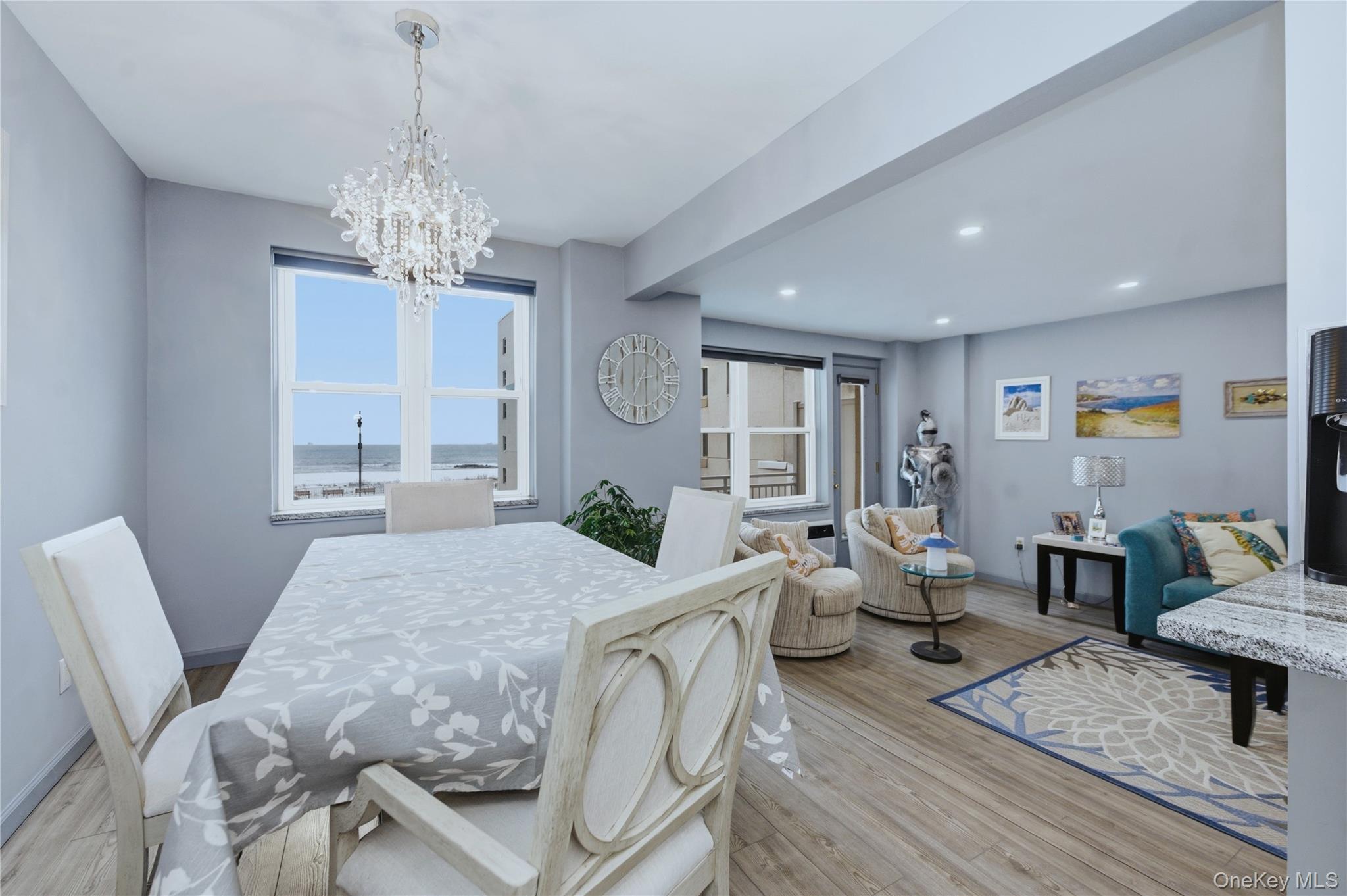 522 Shore Road, Unit 2AA Long Beach, NY 11561 - Photo 11 of 32 a view of a dining room with furniture window and wooden floor