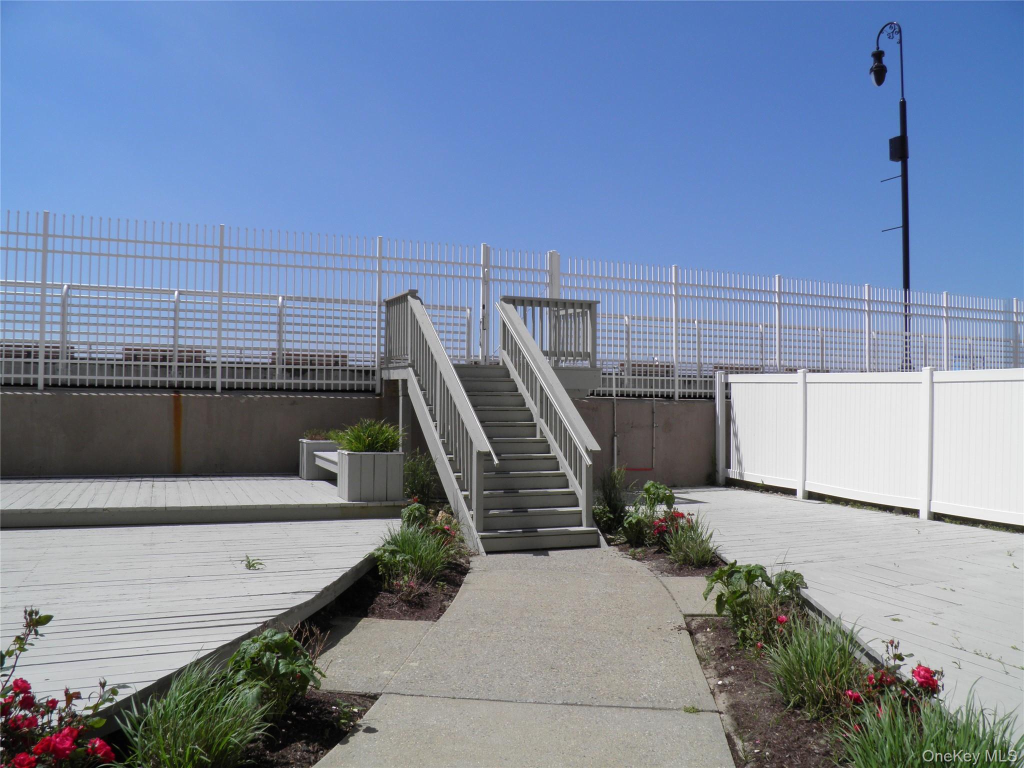 522 Shore Road, Unit 2AA Long Beach, NY 11561 - Photo 30 of 32 a view of a terrace with wooden floor