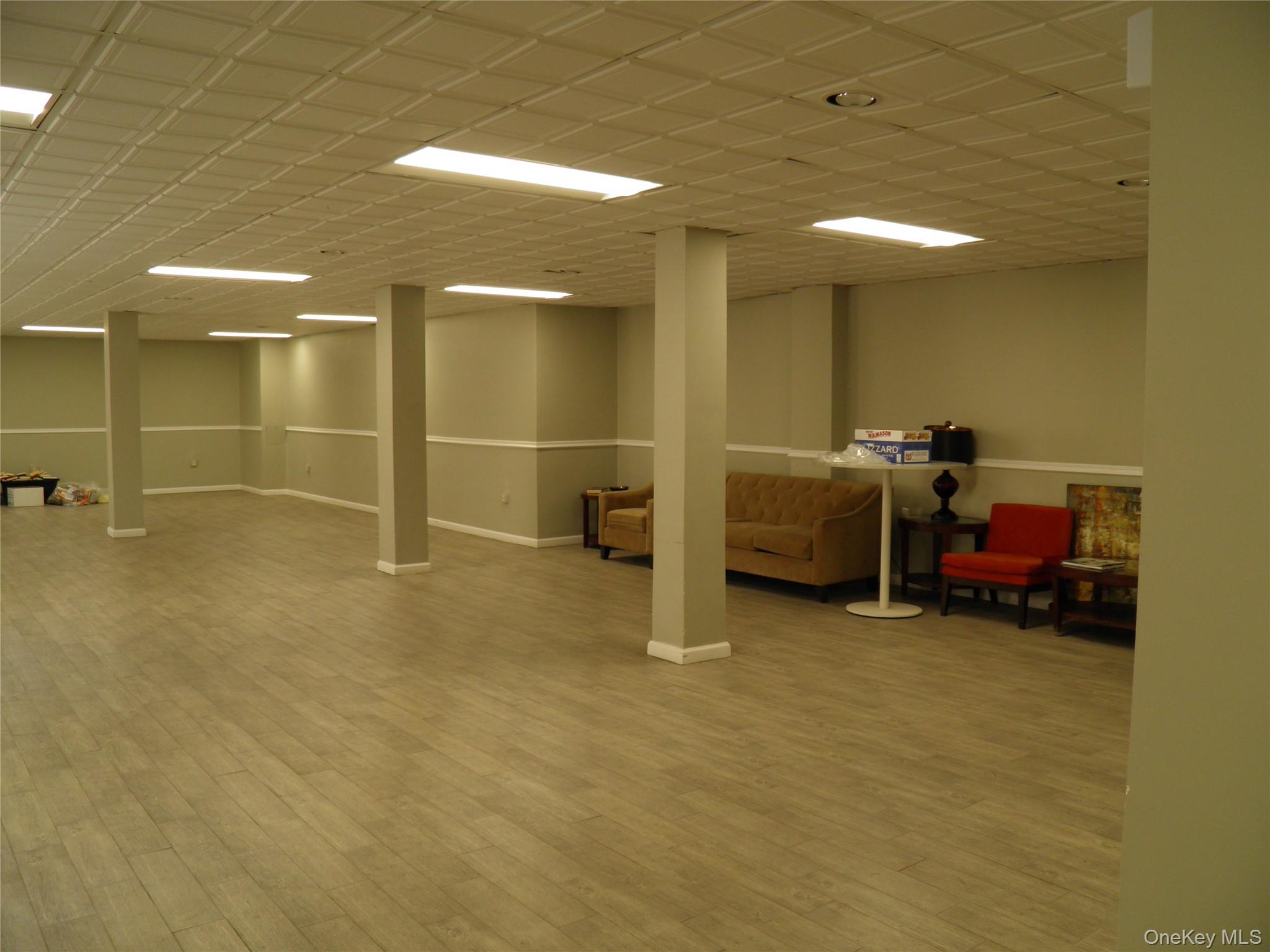 522 Shore Road, Unit 2AA Long Beach, NY 11561 - Photo 31 of 32 a view of a livingroom with furniture and a ceiling fan