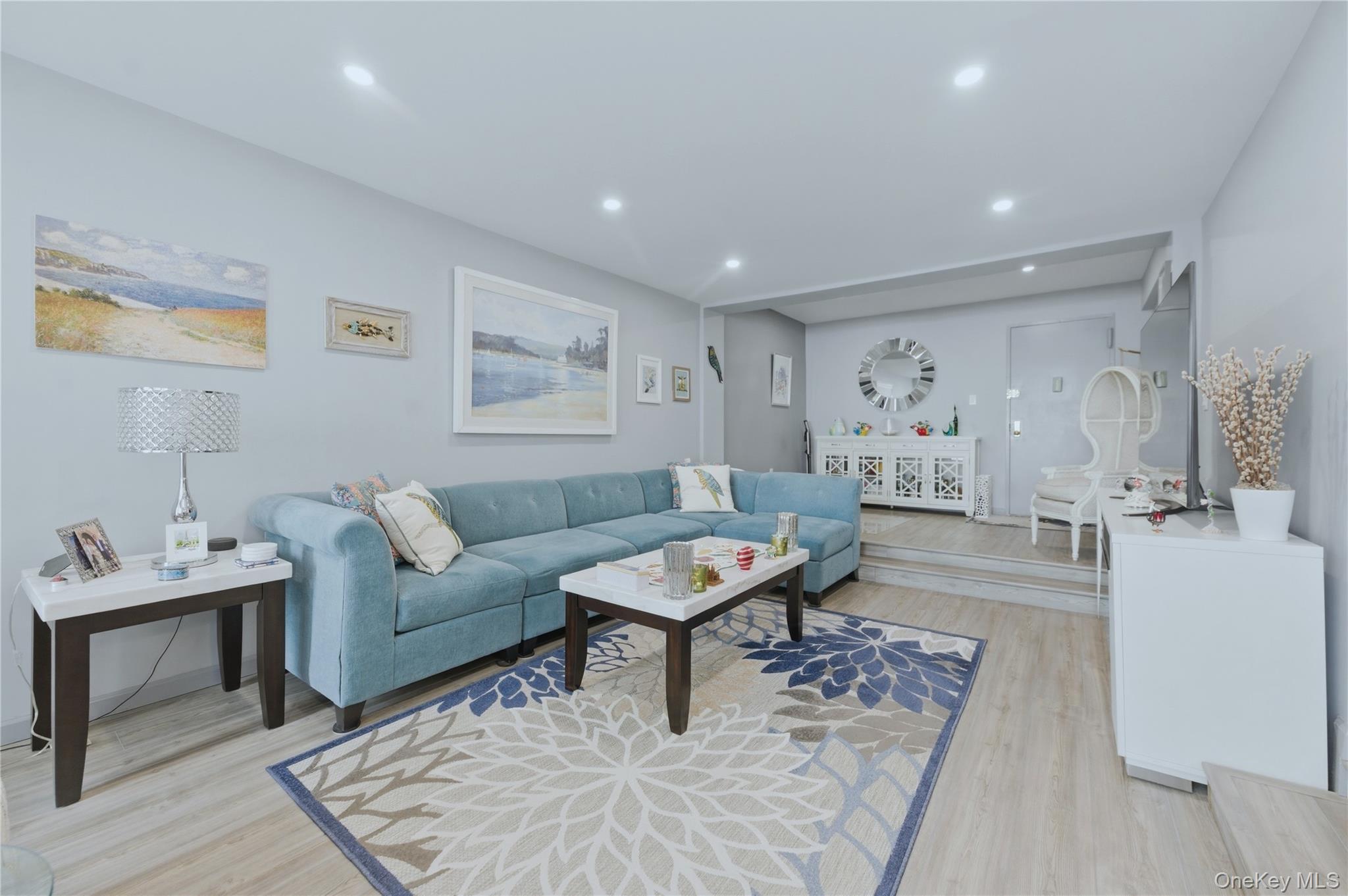 522 Shore Road, Unit 2AA Long Beach, NY 11561 - Photo 8 of 32 a living room with furniture and a rug