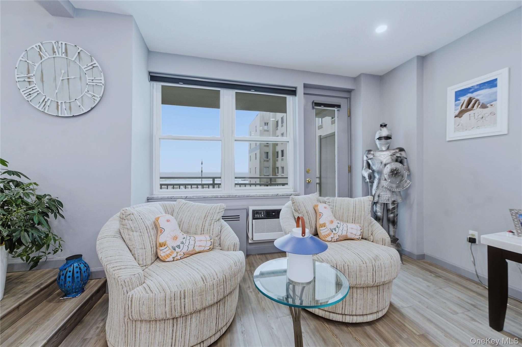 522 Shore Road, Unit 2AA Long Beach, NY 11561 - Photo 9 of 32 a living room with furniture and wooden floor