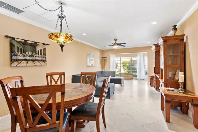 a view of a dining room with furniture wooden floor and chandelier