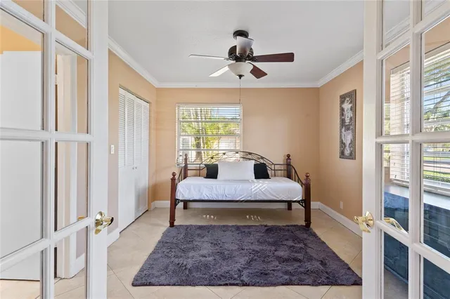 a large bedroom with a bed and a rug