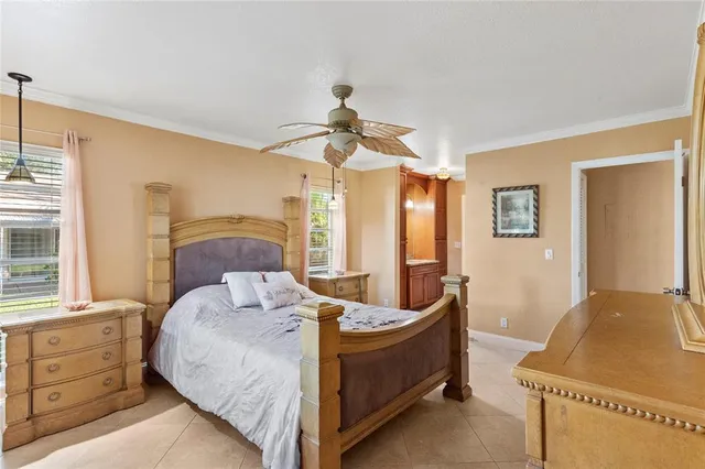 a bedroom with bed and window