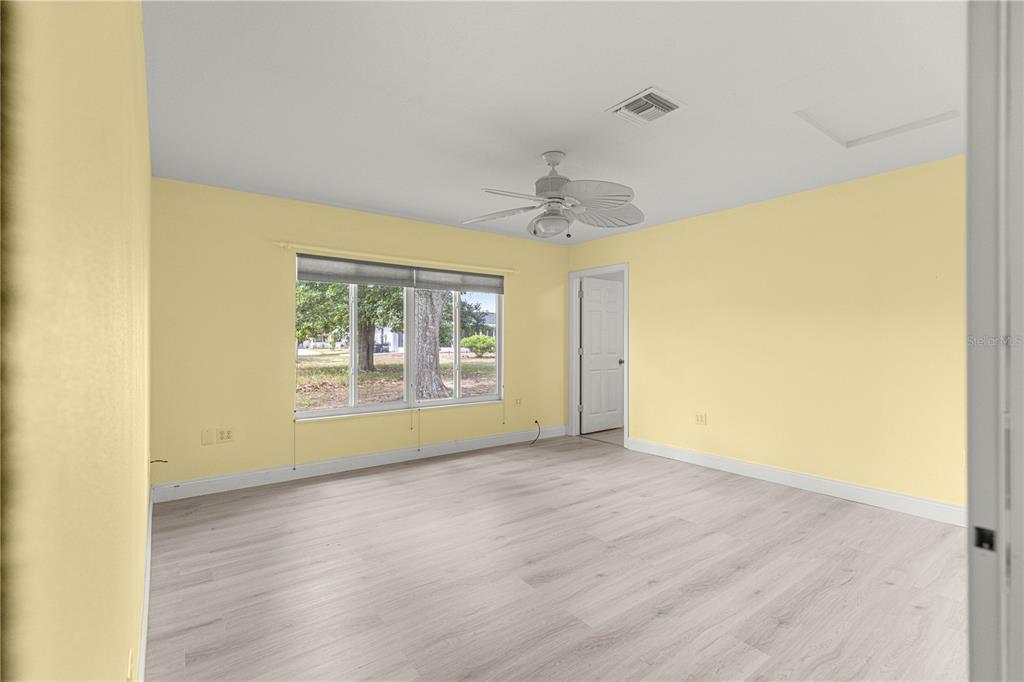 8470 Southwest 107th Place Ocala, FL 34481 - Photo 19 of 44 a view of an empty room with a window