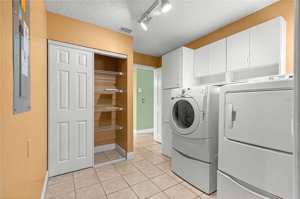 8470 Southwest 107th Place Ocala, FL 34481 - Photo 21 of 44 a utility room with dryer and washer
